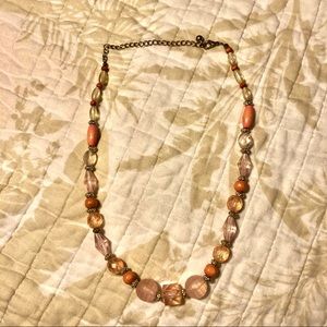 Pink plastic and wooden beaded necklace